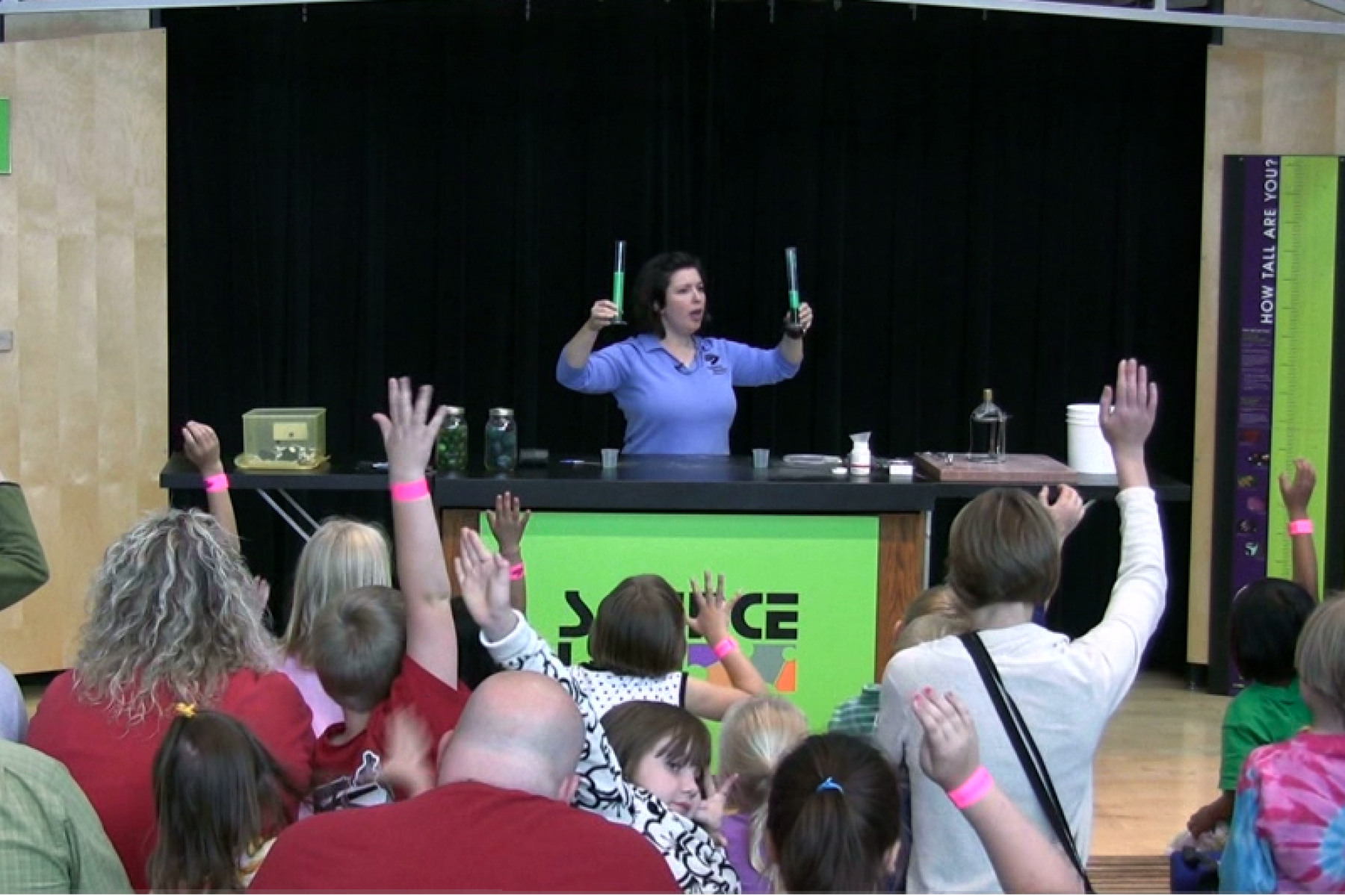 Surface area demonstration in front of crowd of museum visitors