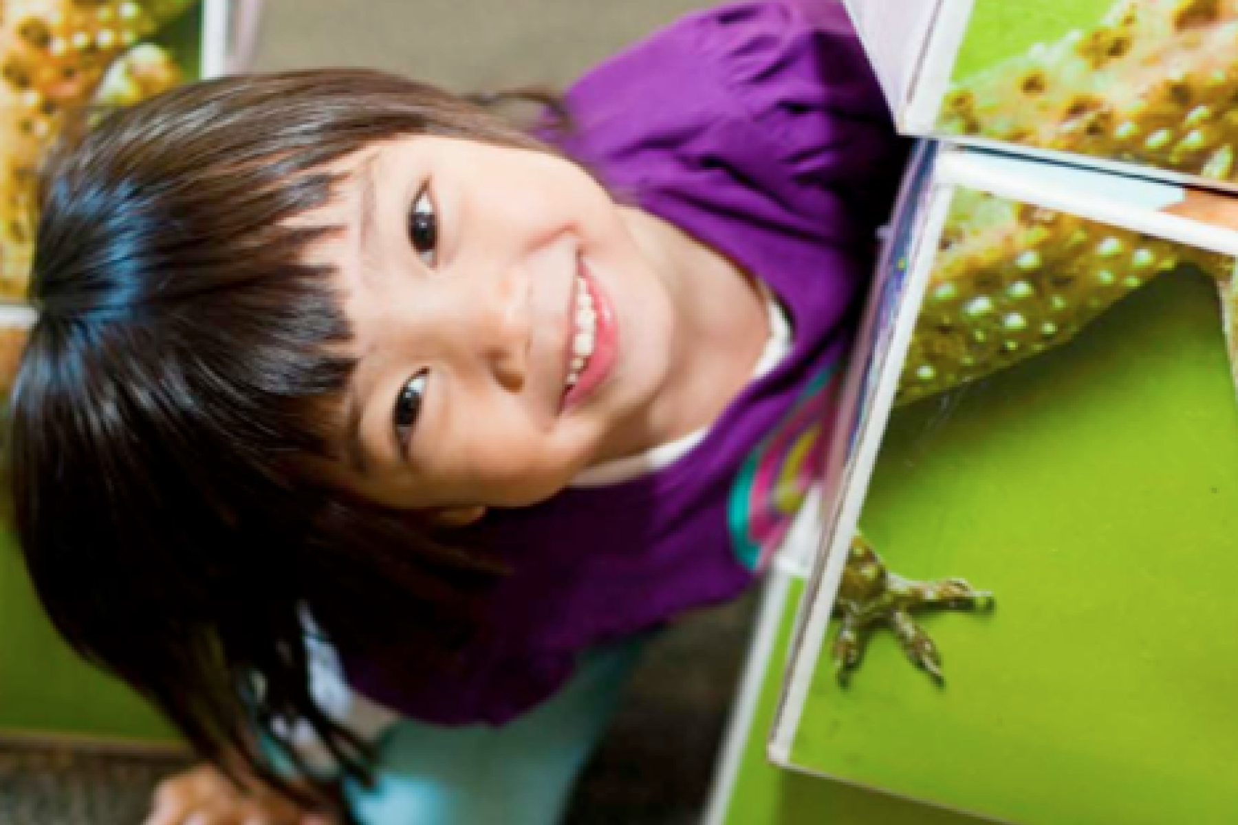 a girl playing with large nanoblock puzzle