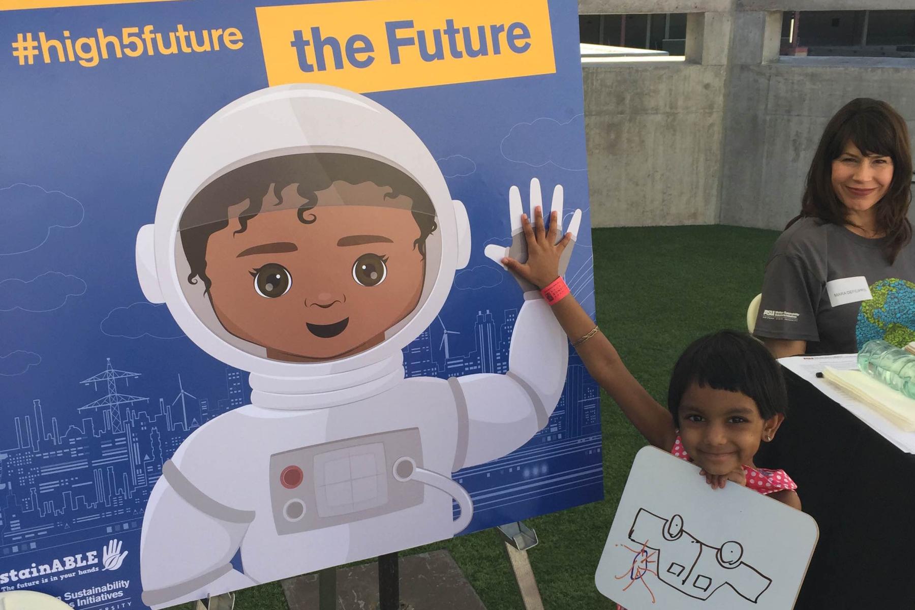 image of a young learner high-fiving a poster with an illustrated astronaut