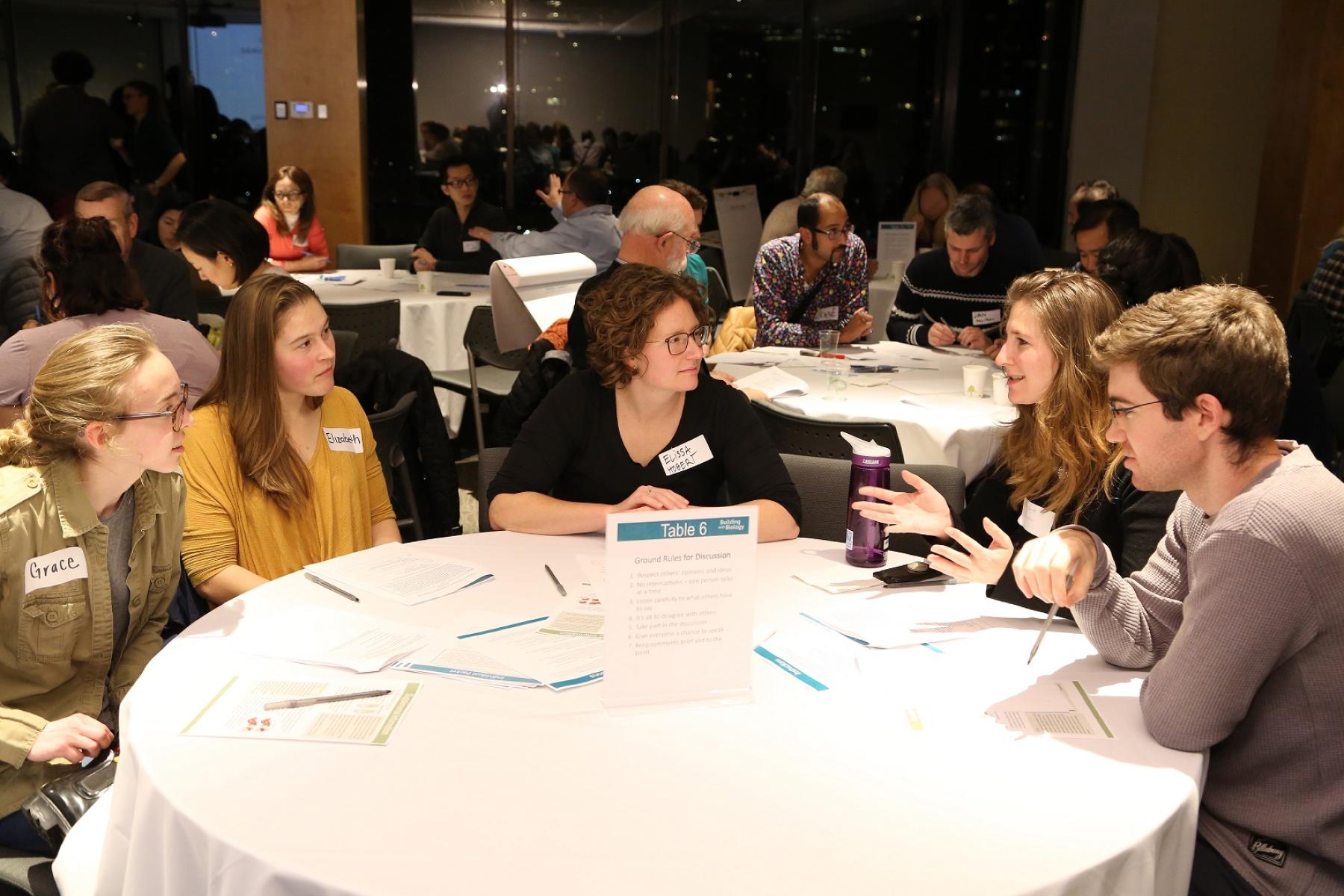 People having discussion at public forum