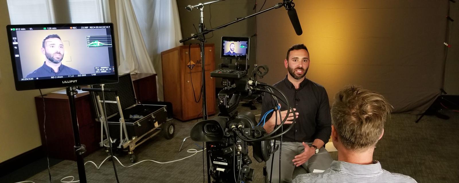 Scientist being interviewed and filmed