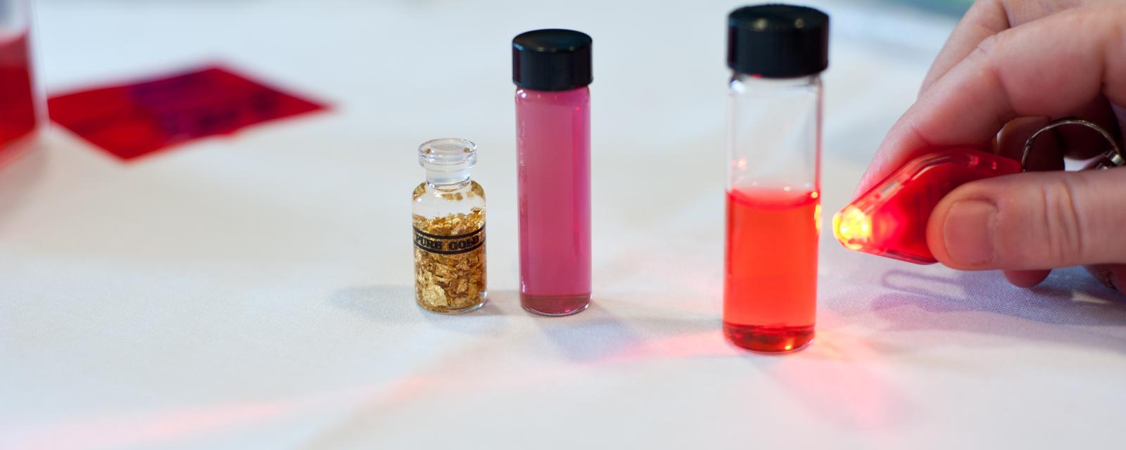 Vials showing nanoscale gold particles that appears red.